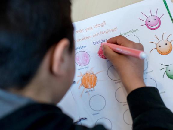 Child painting on paper